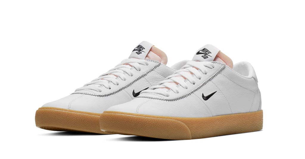 nike sb orange label bruin shoes, white leather, black nike swoosh, gum sole, white background