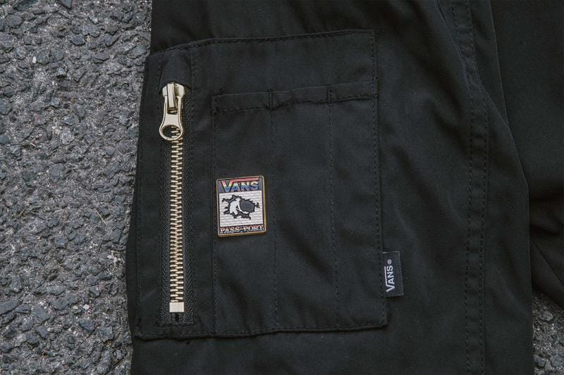 bomber jacket side pocket, vans pass port logo, enamel pin, close up view